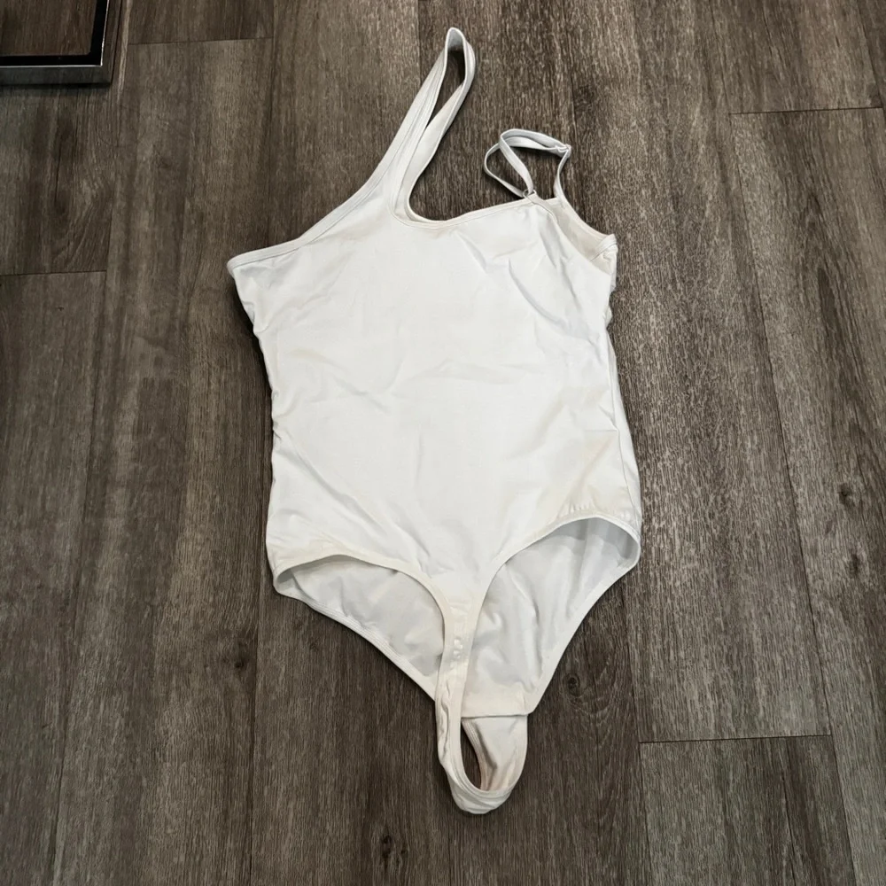 White asymmetrical thong bodysuit